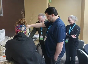 a group of adults gathered around a table